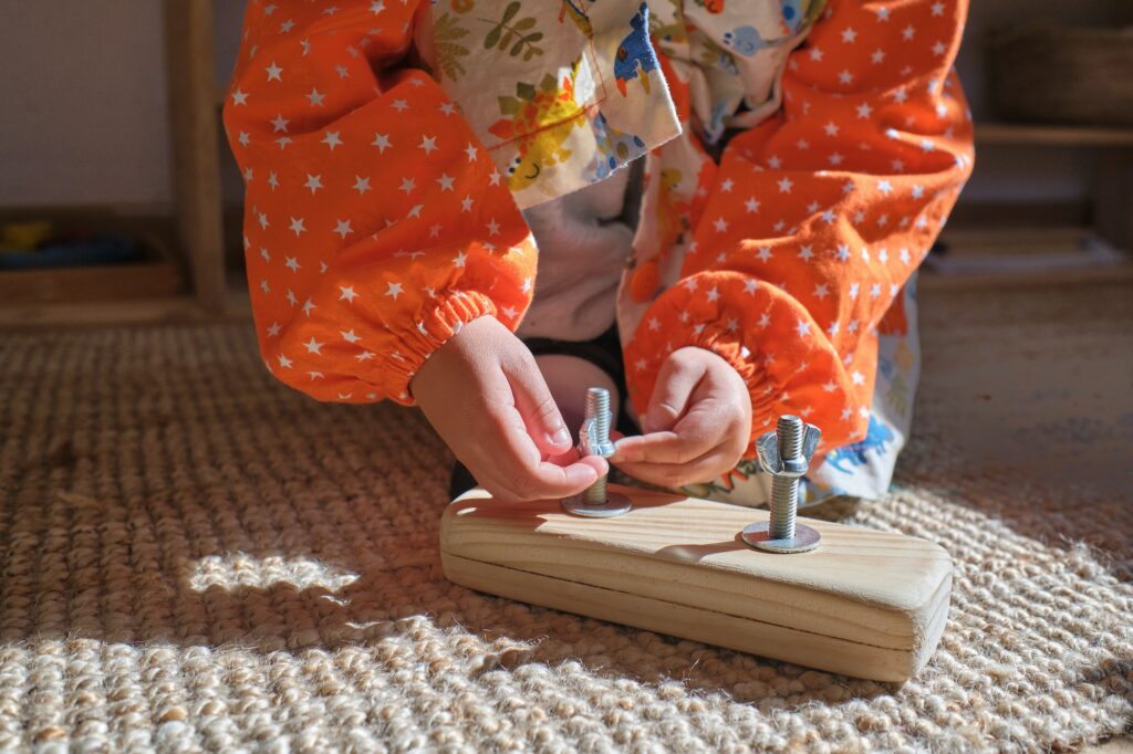 children's hands with a montessori learning set